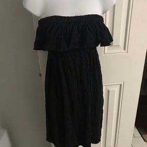 Black off the shoulder dress.